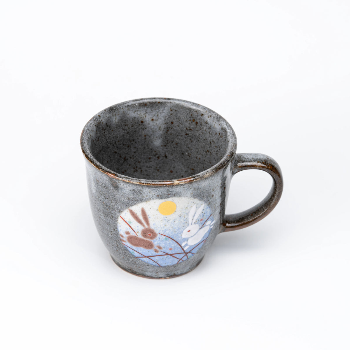 Blue-panel rabbit mug viewed from above.
