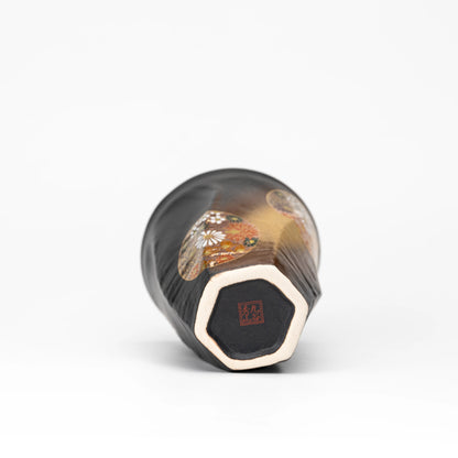 Underside of the black Kutani cup with a red maker's mark.