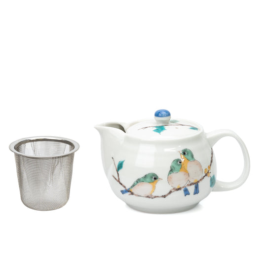 Kutani three-bird teapot with its removable mesh strainer beside it.