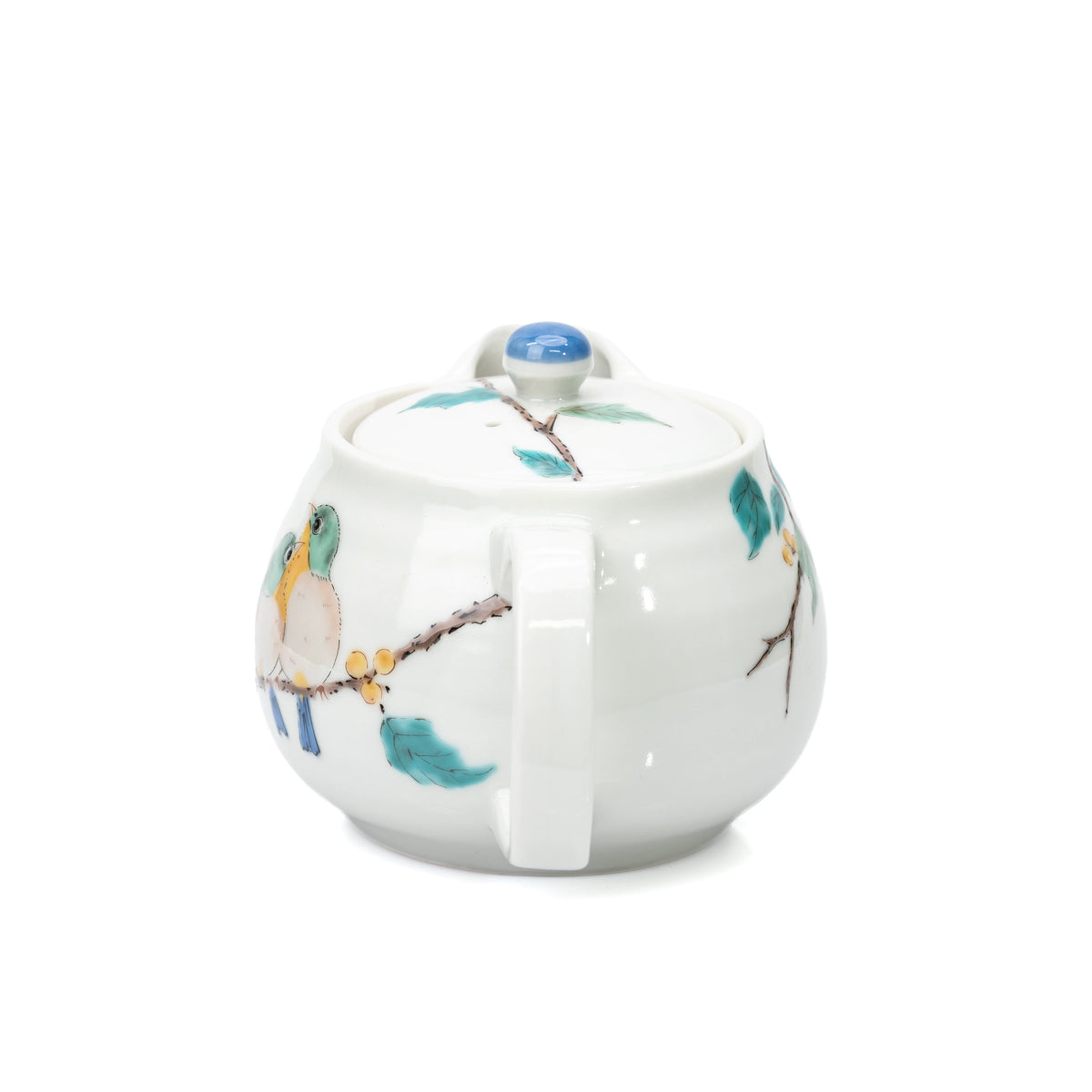 Handle-side view of the Kutani bird teapot and painted branch.