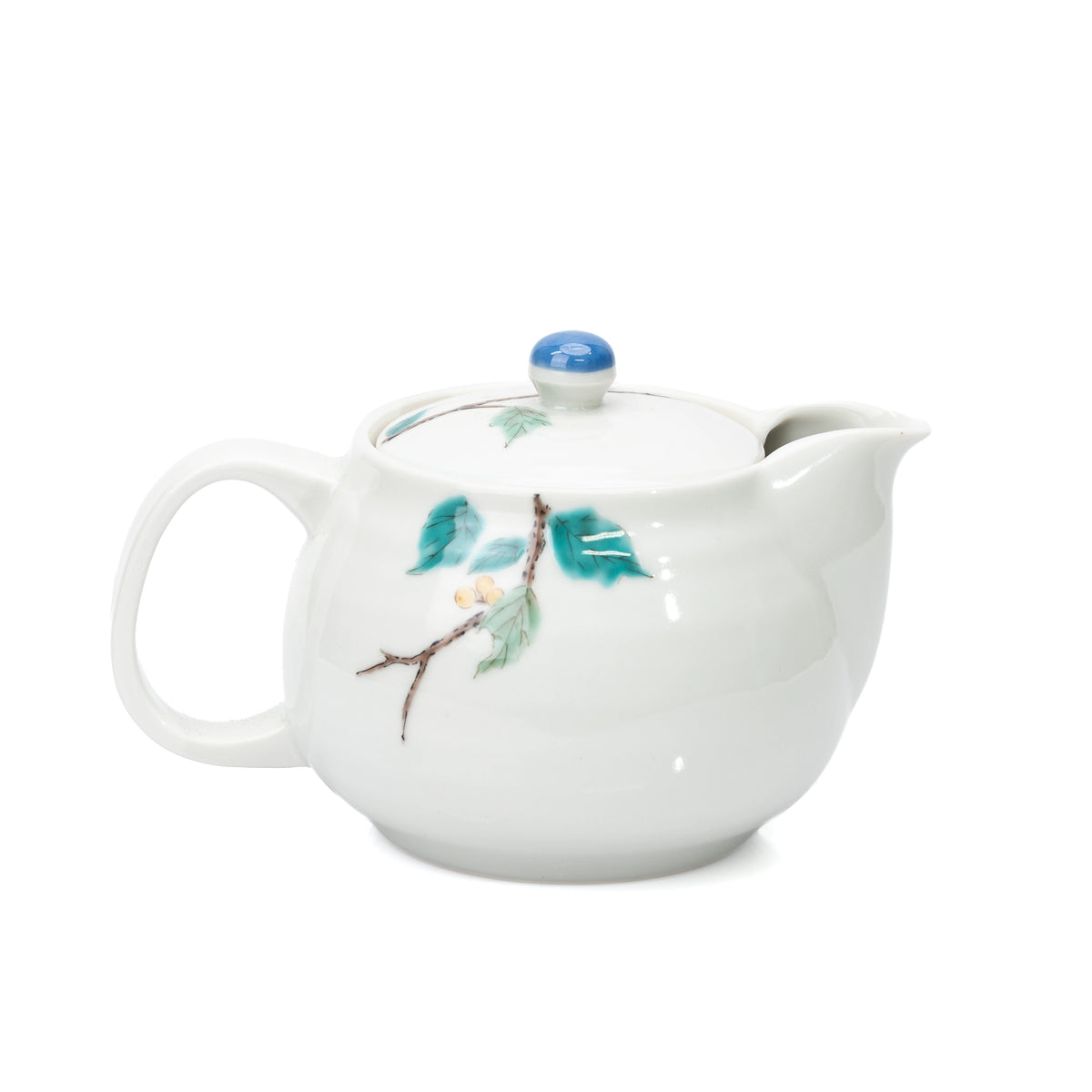 Back view of the white Kutani bird teapot with green leaves.