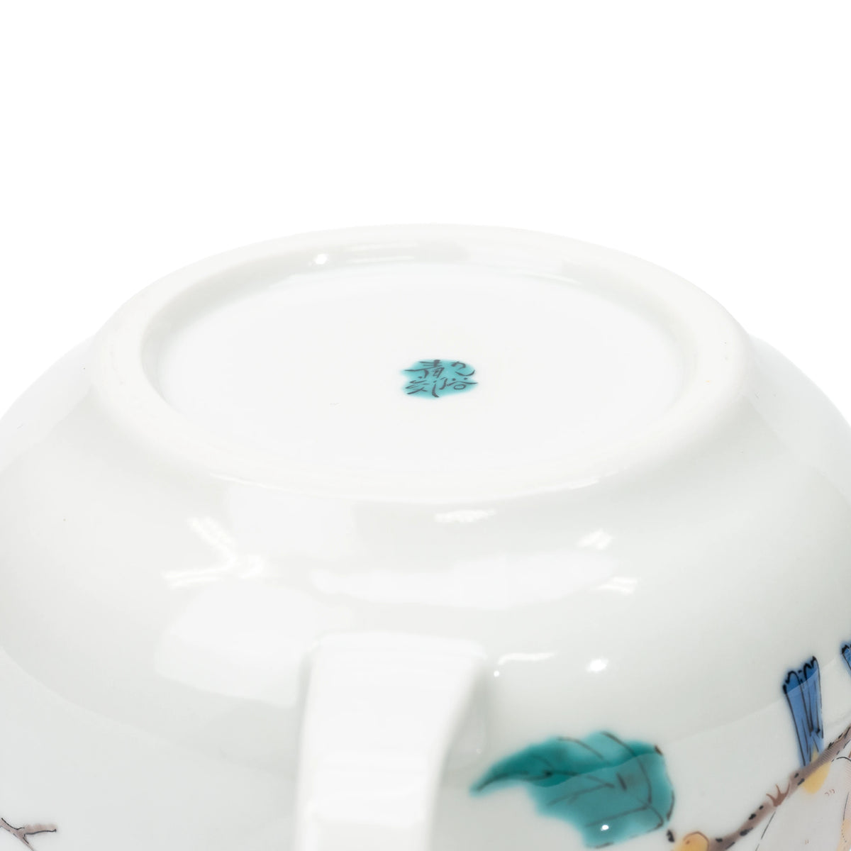 Underside of the Kutani teapot showing its foot ring and maker's mark.