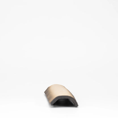 Underside of the curved ceramic incense tray.