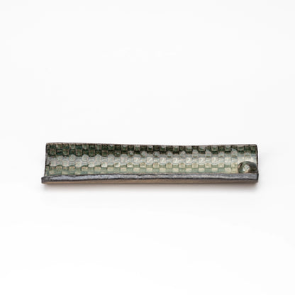 Long green mosaic incense tray shown from above.