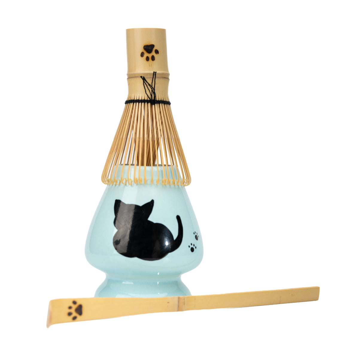 Bamboo mini whisk resting on the cat holder with a paw-print scoop in front.