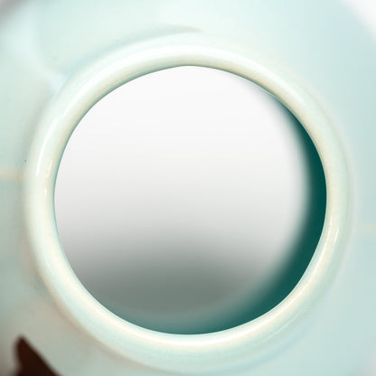 Close-up through the circular base opening of the whisk holder.