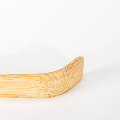 Close-up of the raised curved tip and fine bamboo grain.