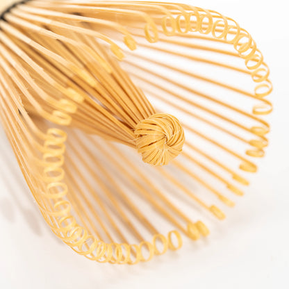 Top view of the whisk's fine curled bamboo tines.