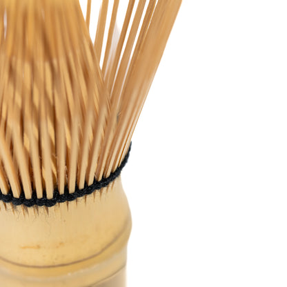 Close-up of fine bamboo tines and black thread binding.