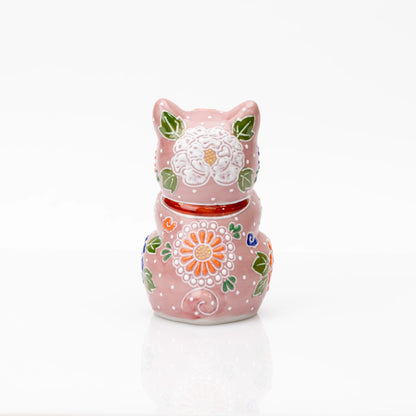 Back of the pink floral praying cat with a red collar.