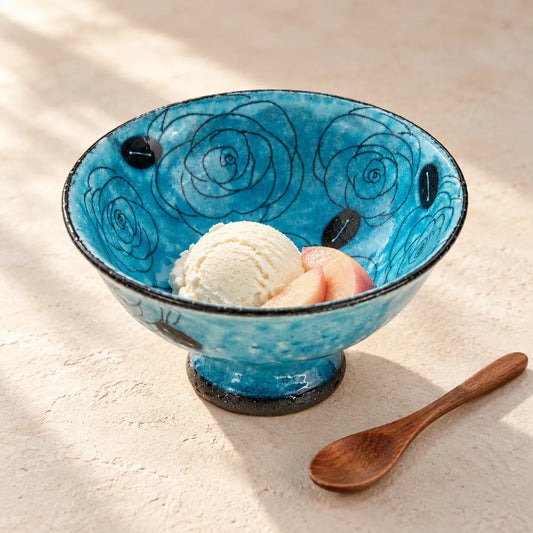 Blue Seto dessert bowl with a carved rose pattern, holding vanilla ice cream and peach slices