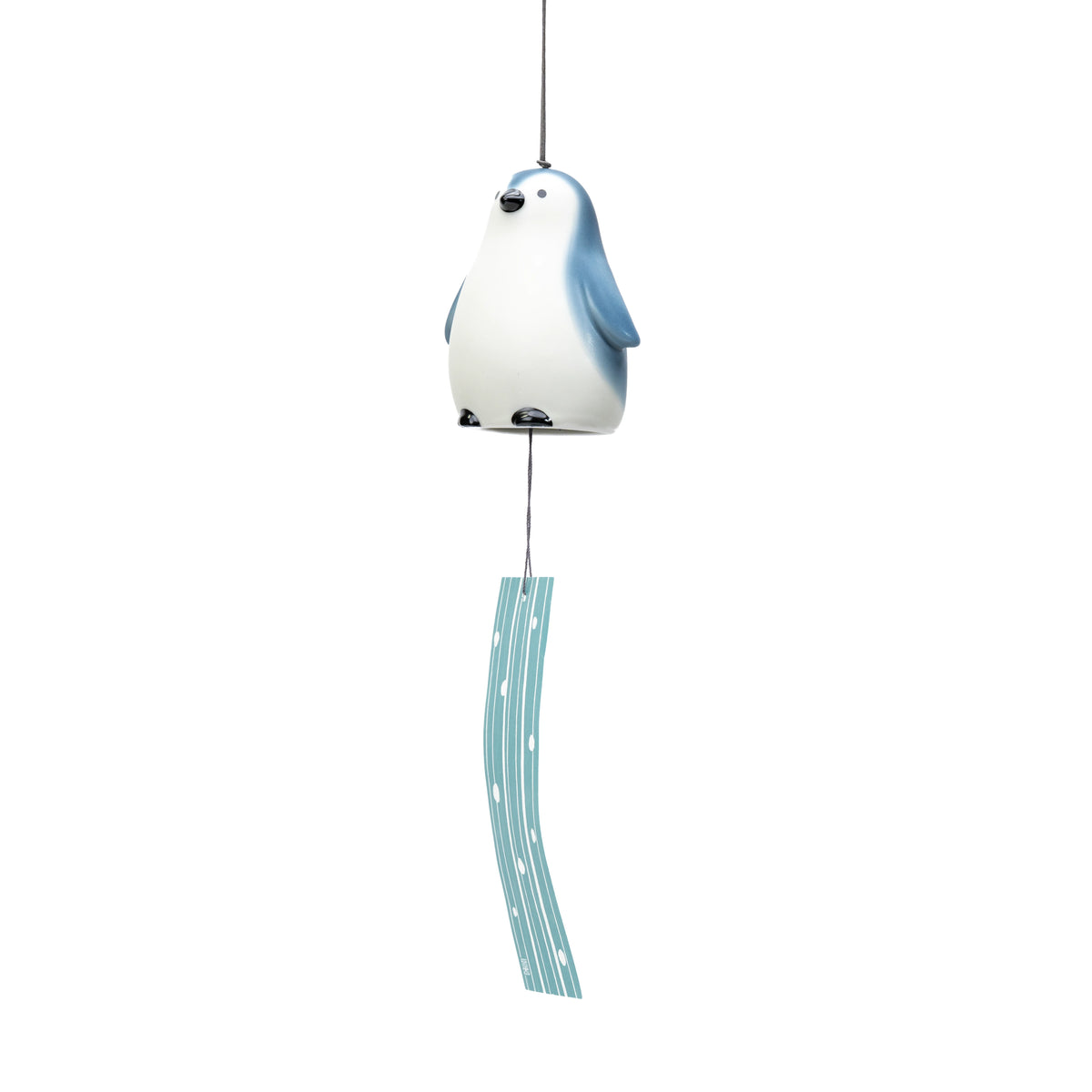 Full hanging view of the penguin wind chime and pale blue paper strip.
