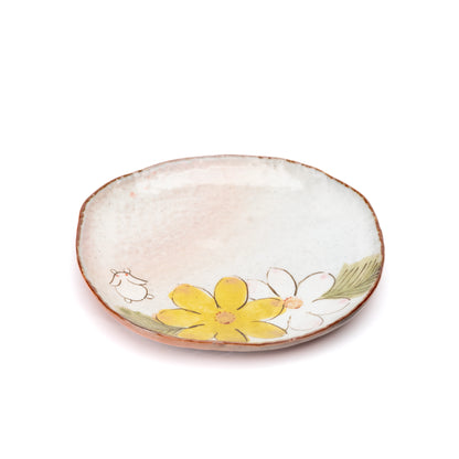 Rounded rectangular saucer with yellow flowers and a small white rabbit.