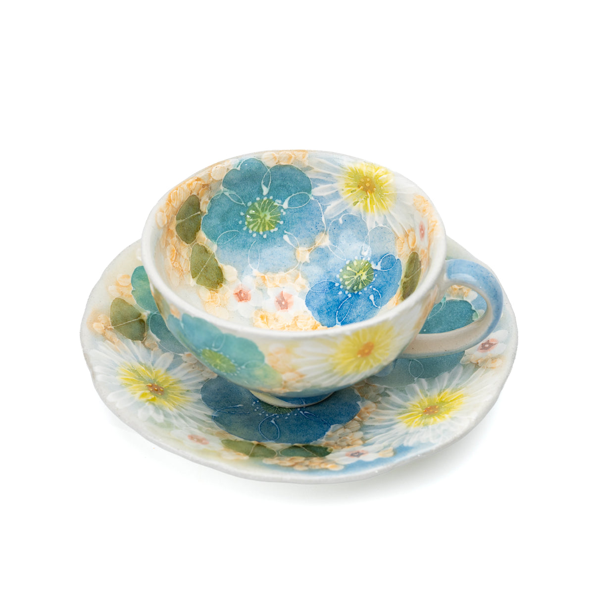 Cup and matching floral saucer viewed from above.