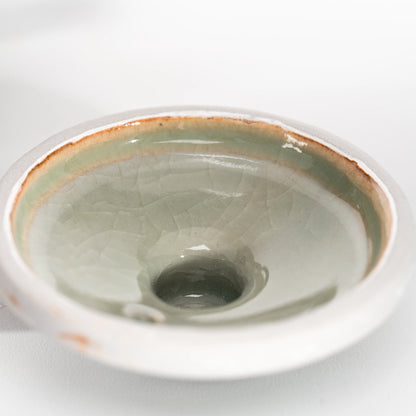 Glazed underside of the teapot lid, showing the circular inner rim.