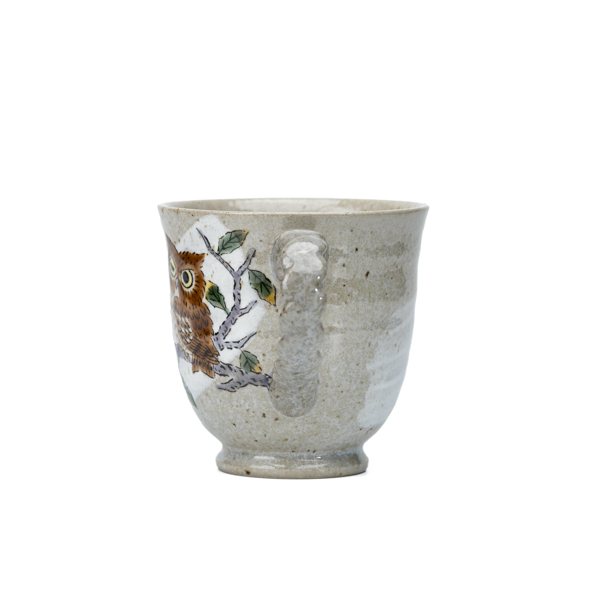 Side view of the Kutani three owls mug showing owl decoration and its rounded body.