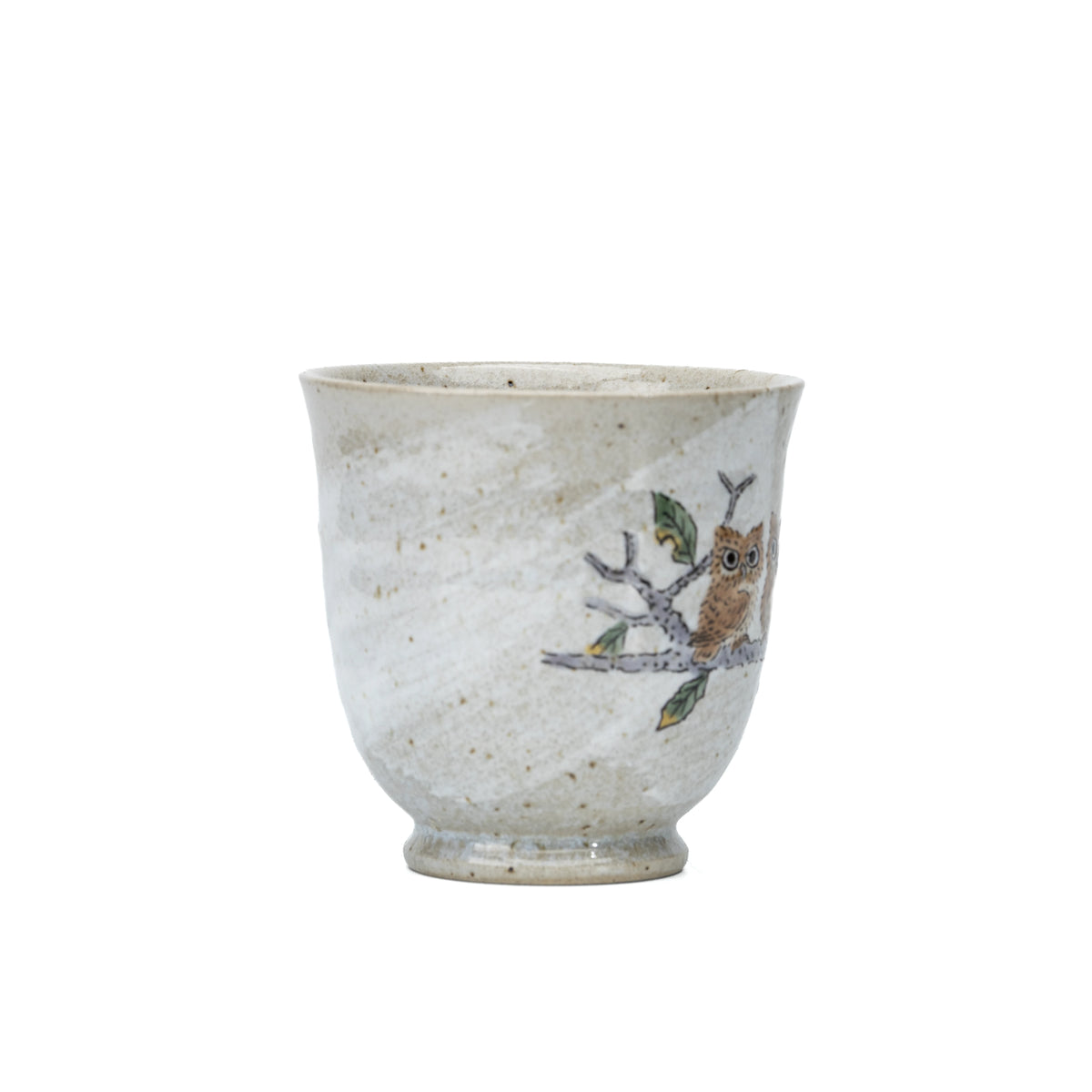 Side view of the Kutani three owls mug showing leaves near the handle.