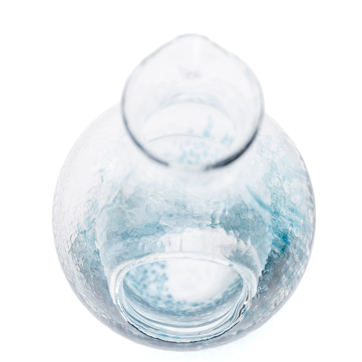 Top view into the blue glass carafe and its interior.