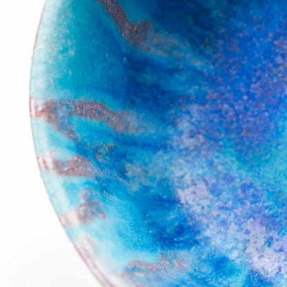 Blue and purple-brown glaze along the bowl's inner wall.