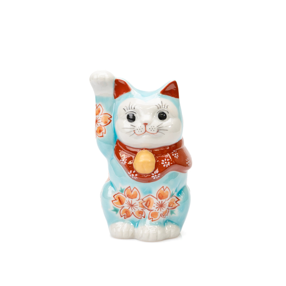 Turquoise Kutani lucky cat with raised right paw, cherry blossoms and a red bib on white.