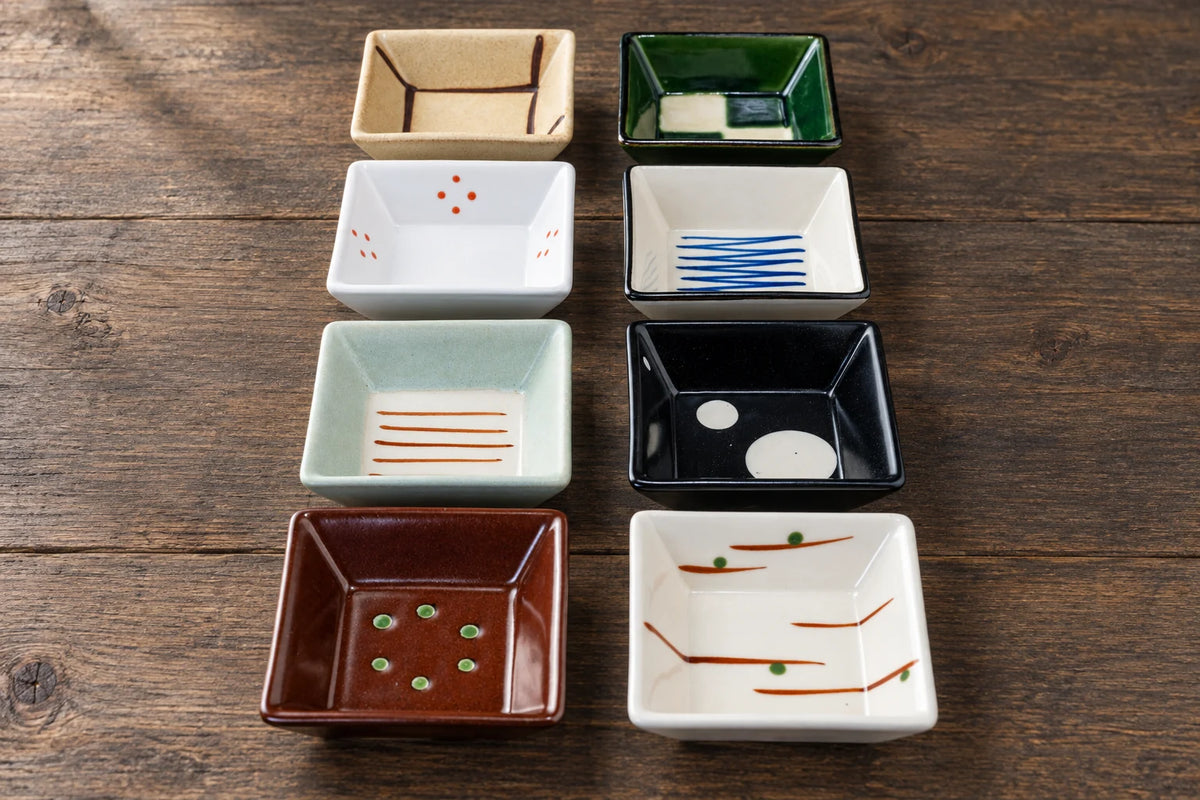 housewarming gifts — selected objects on a wooden studio table.
