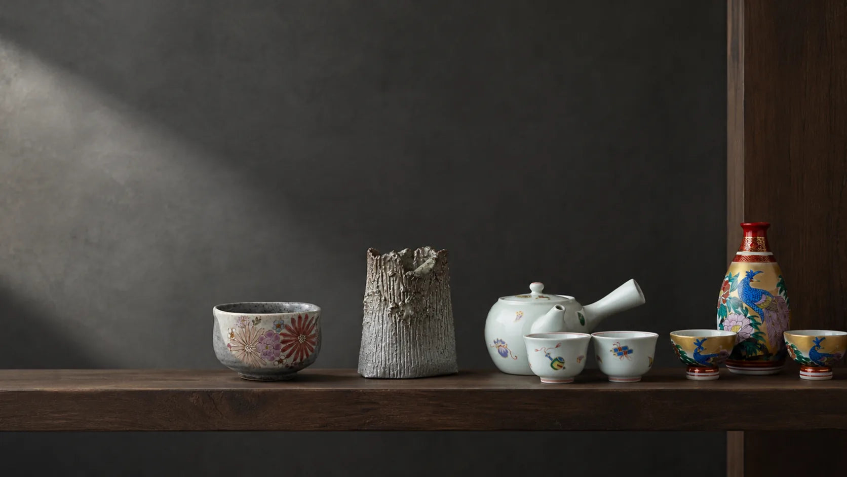 Kutani porcelain, Arita teaware, Shigaraki stoneware and Japanese sake ware arranged as a kiln study.